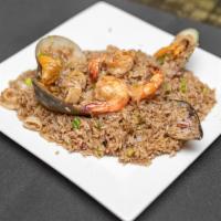 Arroz con Mariscos · Seafood rice, octopus, calamari, shrimp, clams, and mussels.
