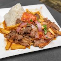 Lomo Saltado a Lo Pobre · Santeed chunks of beef with red onions and tomatoes served with rice, sweet plantain, and fr...