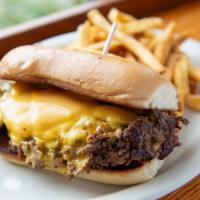 Black Angus Philly Cheesesteak Sandwich · Black Angus flat iron steak shaved thin and grilled with braised onions and melted American ...