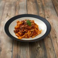 Tagliatelle Bolognese · Flat noodles in a fresh meat sauce.