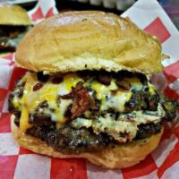 1. Bomb Burger · Deconstructed jalapeno popper stuffed between two 5 oz. patties topped with tons of cheese b...