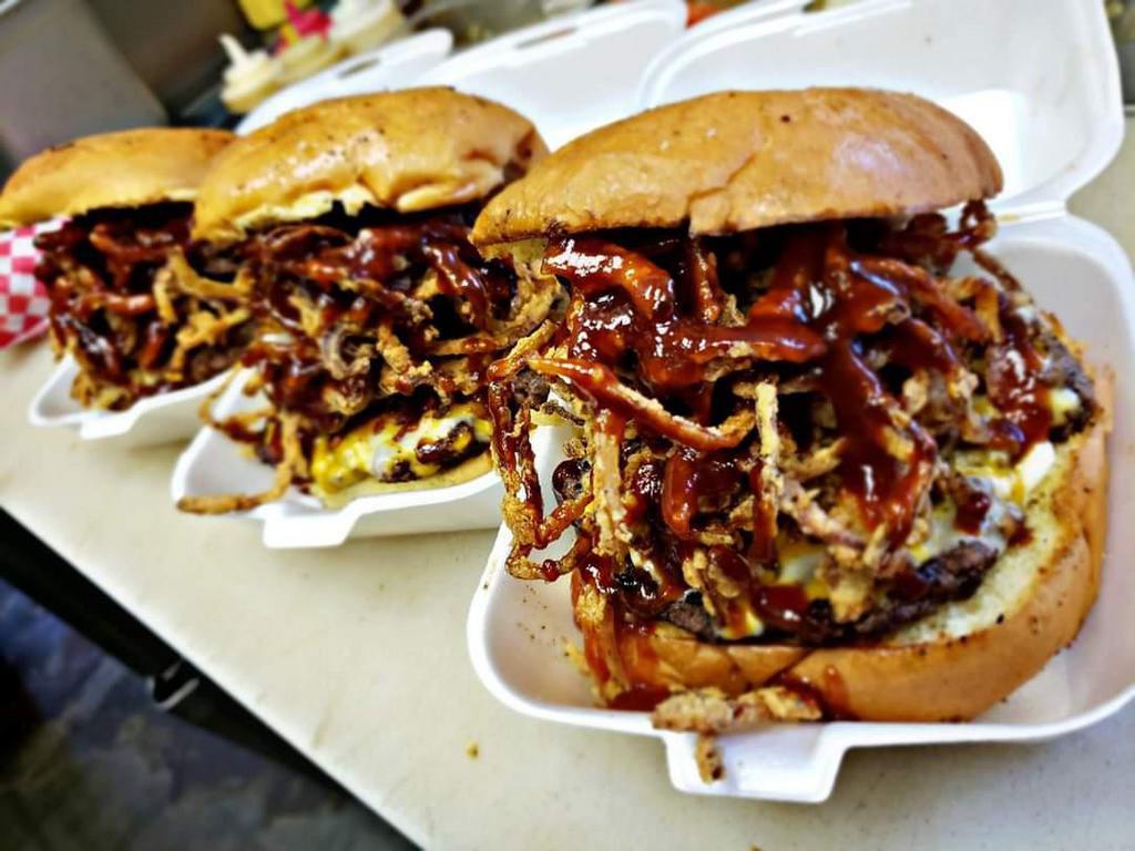 Bacon Cheddar BBQ Burger · Crisp bacon, tons of melted cheddar cheese (fresh sliced), crispy fried onion ring stacks, mayo and drizzled in BBQ sauce!!