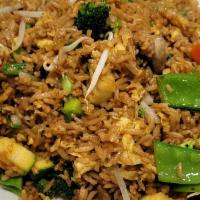 Chinese-Style Vegetable Fried Rice · A classic Chinese egg fried rice wok-tossed with a medley of chopped broccoli, snow peas, zu...