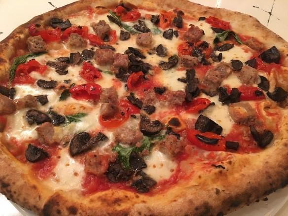 Maradona Pizza · Fresh mozzarella, Italian sausage, Peppadew peppers, mushrooms, Pecorino Romano and basil.