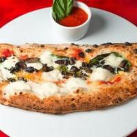 Scugnizzo Calzone · Baked. Half-moon calzone stuffed with fresh mozzarella, ricotta, cherry Vesuvian tomatoes, a...
