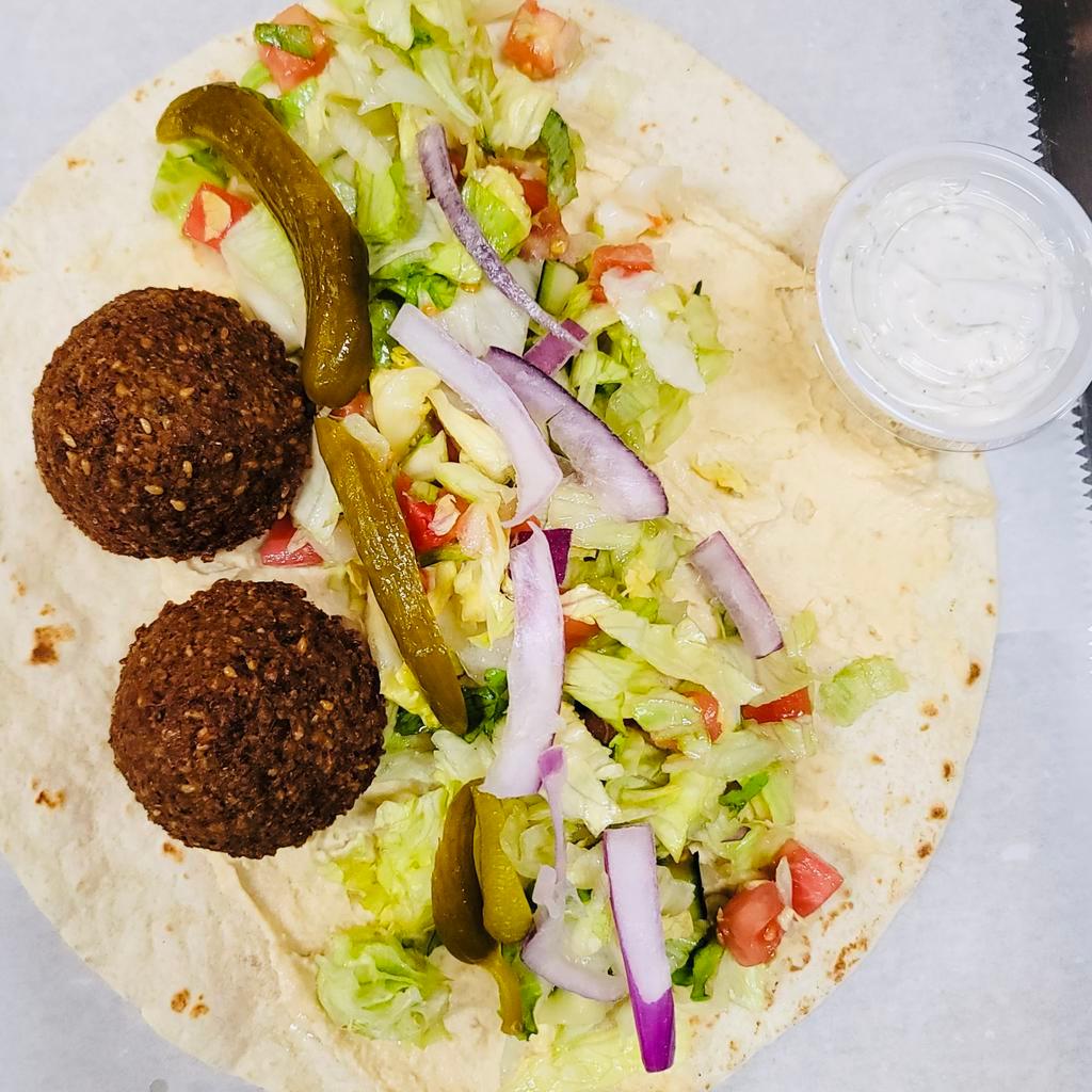 Falafel Sandwich · Falafel, Pita Bread, Lettuce, Tomato, Hummus, Pickle. Meatless sandwich made from chickpeas and spices. 