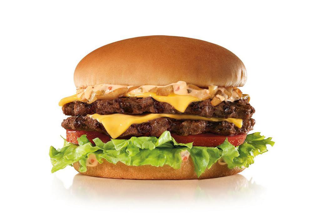 California Classic Double Cheeseburger · Two charbroiled all-beef patties, American cheese, grilled onions, Classic Sauce, lettuce and tomato on a plain bun. 
