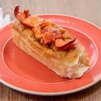 Tin Fish Lobster Roll with Fries · Butter grilled Lobster with Italian parsley, sizzled with lemon squeeze, tucked to a warm br...