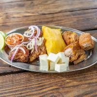 Appetizers by Brothers · Tamale, fried pork chunks, cheese criollo, pork skin, onions and pico de gallo.