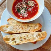 GARLIC BREAD · House bread, garlic & herb butter, Parmigiano Reggiano, Pomodoro sauce