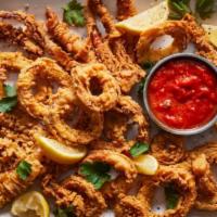 FRIED CALAMARI · Breaded Calamari rings and tentacles in light, spicy marinara sauce