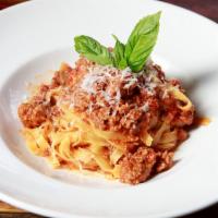 Bolognese · Fresh tagliatelle pasta; veal, pork & beef simmered slowly in Pomodoro sauce