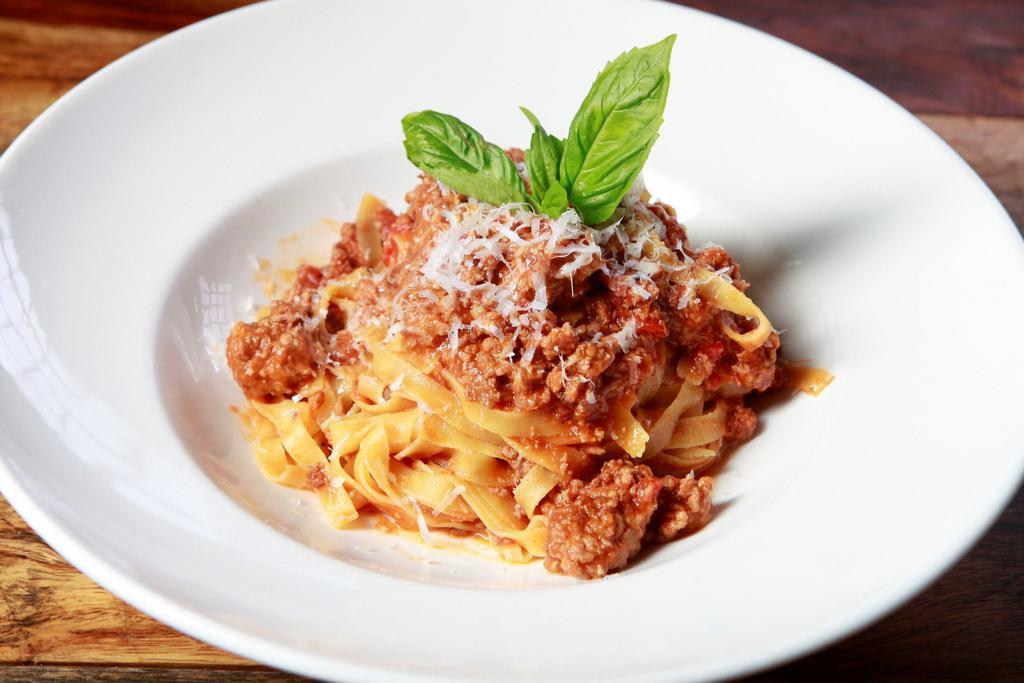 Bolognese · Fresh tagliatelle pasta; veal, pork & beef simmered slowly in Pomodoro sauce