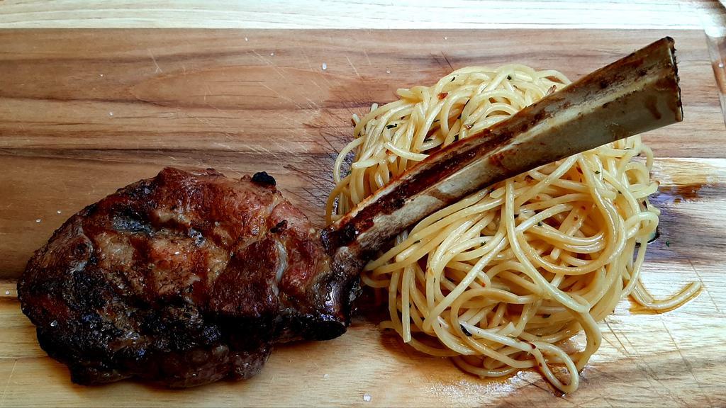 VEAL CHOP · 16oz prime grilled veal chop with spaghetti aglio e olio