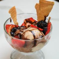 Trio Di Gelati · Pistacho, vanilla & gianduia gelato, berries, caramel, & chocolate glaze