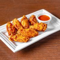 Chicken Wings · A deep-fried chicken wing, not in spicy sauce.