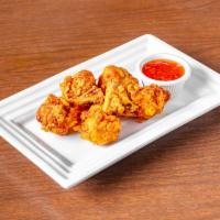Chicken lollipop ·   Indo-Chinese style marinated, batter fried chicken wings, served with homemade sweet chill...