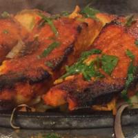 Fish Tikka · Marinated salmon cubes barbecued in the tandoor and served with aromatic basmati rice and cu...