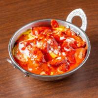 Butter Chicken · Chicken cooked with spices, herbs and butter in tomato sauce.