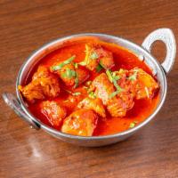 Chicken Vindaloo · Chicken with potatoes in a tangy sharp sauce. Served with aromatic basmati rice.