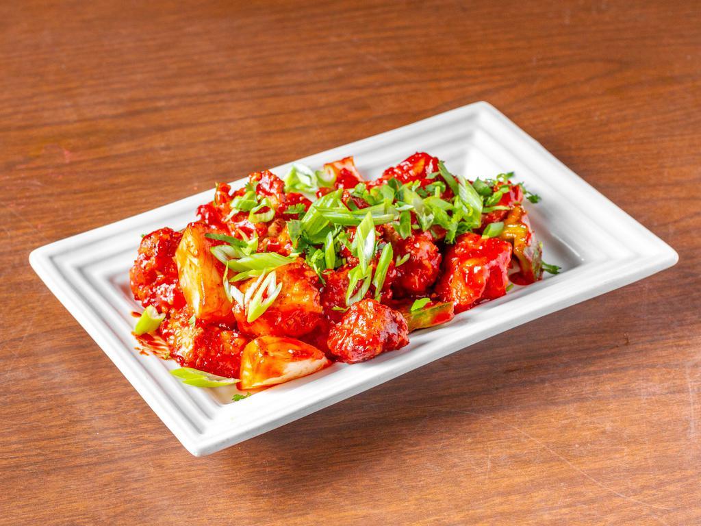 Chili Chicken · Chicken cooked with bell pepper, onion, soy sauce, ketchup and jalapeno slices in an Indo-Chinese style. Served with aromatic basmati rice.
