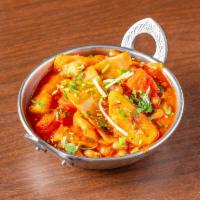 Alu Gobi · Cauliflower and potatoes cooked with onions and spices. Served with aromatic basmati rice.