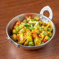 Bhindi Masala · Okra cooked with onions and delicious tangy spices. Served with aromatic basmati rice.