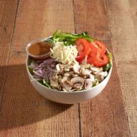 House Salad · Iceberg and romaine lettuce, mushrooms, tomatoes, green peppers and red onions topped with m...