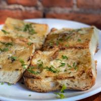 Roasted Garlic Bread · whole cloves roasted until sweet and spread over ciabatta