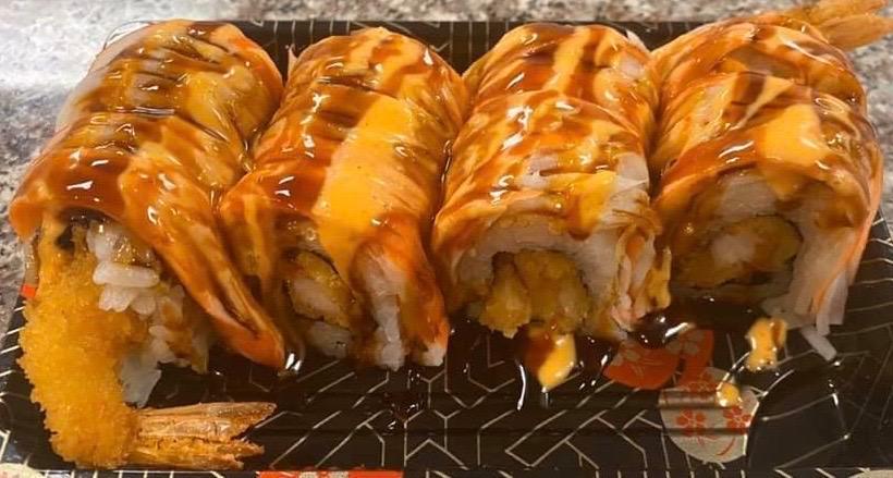 30. Yummy Roll · Inside Shrimp tempura, topped with crab meat, eel sauce and spicy mayo.
