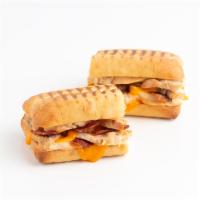 Turkey, Cheddar 'n Bacon Panini · Gobble . . . Gobble! This Panini Melt features our Roasted Turkey, Smoky Bacon and melty-che...