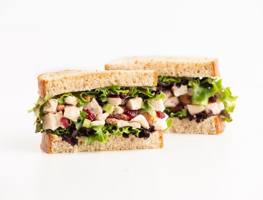 Cranberry 'n Pecan Chicken Salad Sandwich  · Enjoy a taste of summer all year long! Our Chef-inspired, house made Chicken Salad with Chopped Celery, Dried Cranberries and Honey Roasted Pecans is piled high on a bed of fresh, crisp Spring Mix and served between two slices of our hearty Wheatberry bread.