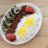 Shish Kabob · Generous pieces of beef, sirloin marinated and skewered, broiled over flames, served with ba...