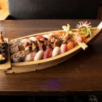 D11. Sushi Boat for 2 · Raw.  12 pieces of sushi, spicy tuna maki, Tokyo special roll, spider maki and crazy maki.