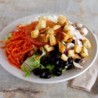 Green Salad · Mixed lettuce, tomato wedges, mushrooms, carrots, black olives, mozzarella and homemade crou...