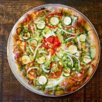 Caroline · Pesto base, cheese, zucchini, sliced tomatoes, white onions, green onions & garlic