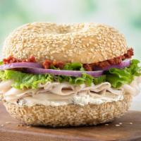 Herby Turkey Sandwich Lunch · Roasted turkey, light herb garlic cream cheese, sun-dried tomato spread, lettuce, and red on...