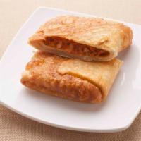 Pizza Puff · Fried and stuffed pizza pocket. 
