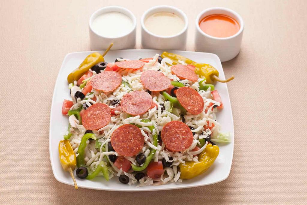 Italian Salad · Iceberg/Romaine Lettuce Mix, Mushrooms, Onions, Green Peppers, Tomatoes, Black Olives, Pepperoncini Peppers, Pepperoni and Mozzarella Cheese.