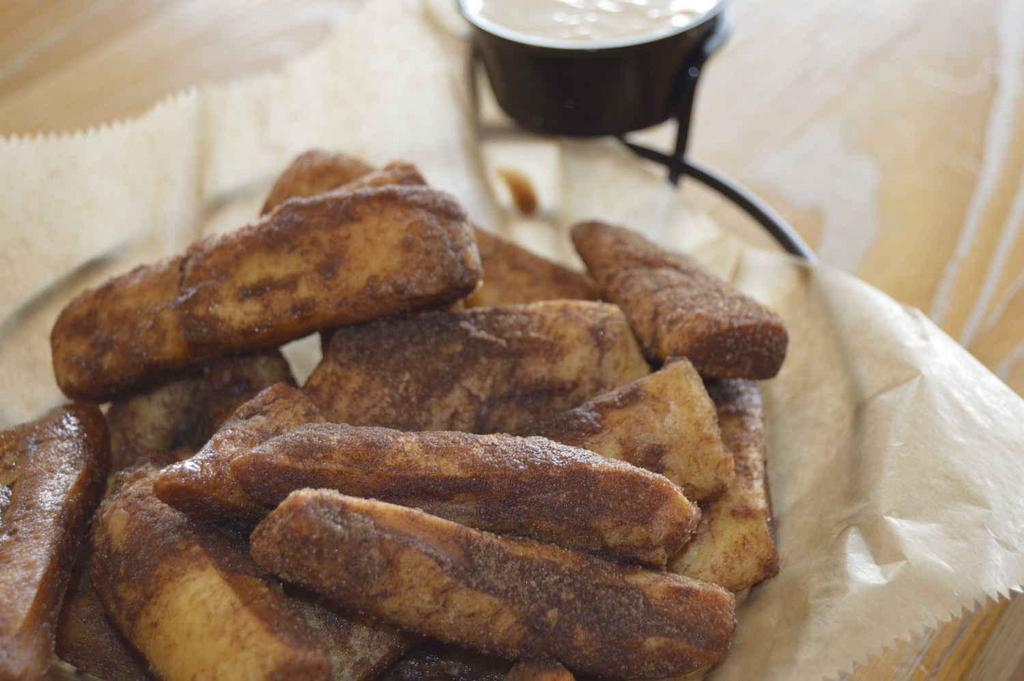 Cinnamon Stix · Made with our homemade recipe and served with cream cheese dipping side.