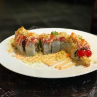Red Dragon Roll · Crispy shrimp tempura, barbequed eel, cucumber, avocado, and scallions, topped with thin sli...