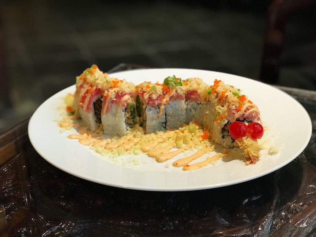 Red Dragon Roll · Crispy shrimp tempura, barbequed eel, cucumber, avocado, and scallions, topped with thin slices of seared tuna, sprinkled with tempura flakes, spicy mayo, eel sauce, and masago. Raw.