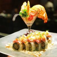 Fancy Lobster · Lobster tempura, eel, avocado, scallions, cucumber inside out with seared tuna on top, sprin...