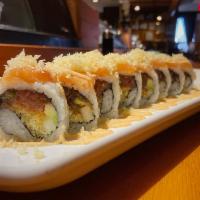 Sakura Roll · Spicy tuna, cucumber, avocado with tempura flakes, topped with salmon and drizzled with spic...
