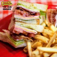 The Club Sandwich · Turkey, ham, American and pepper jack cheeses, bacon, lettuce, tomatoes, honey mustard on gr...