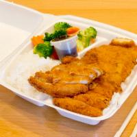 11. Chicken Katsu · Deep fried cutlet in panko breading served with white rice and vegetables.