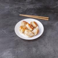 22. Pan Fried Dumplings锅贴 · 6 pieces.
