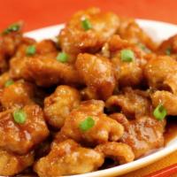 Orange Chicken 陈皮鸡 · Battered and cooked in a sweet orange sauce.