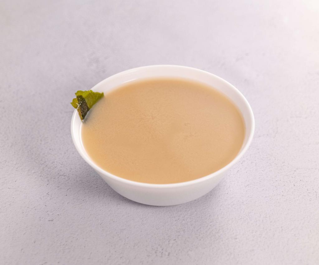 Miso Soup · Dashi based soup with tofu, seaweed, and green onion. 