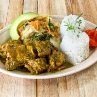 Curry Chicken · Served with white rice or rice and peas, steam vegetables or salad.
